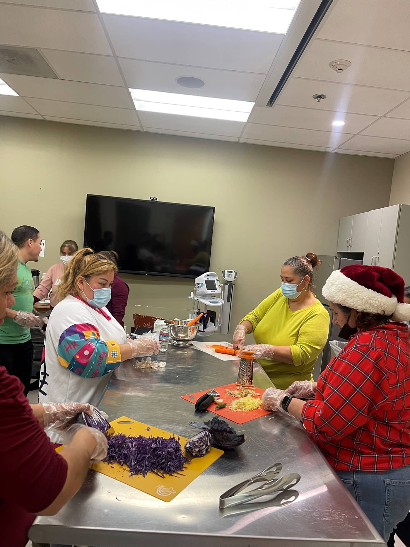 Nutrition education class with community members learning about healthy eating and balanced diets representing the educational programs at California Nutrition Center